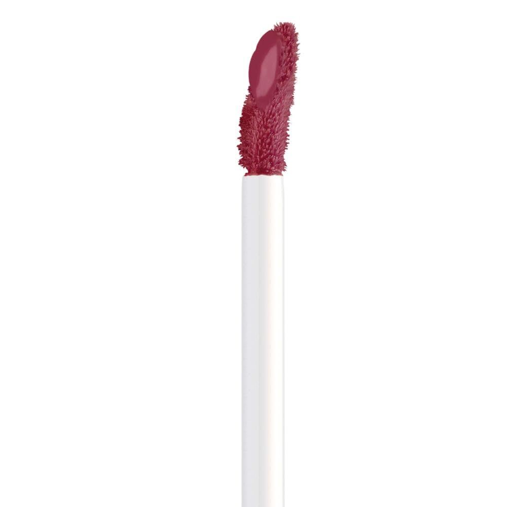 Close-up van een applicator met lipfluid. Witte steel, roze punt.