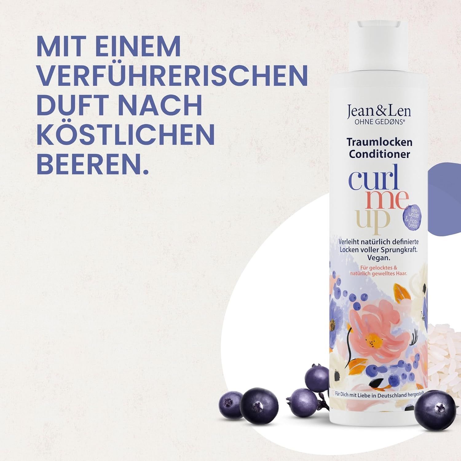 Bouteille de revitalisant Jean & Len Traumlocken. Texte : Avec un parfum séduisant de baies. Baies à côté de la bouteille.