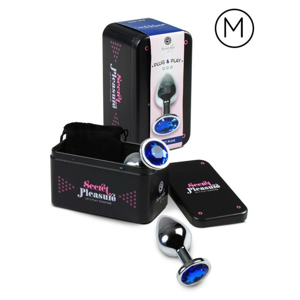 Plug anal avec un bijou bleu, base et tige en métal, présenté en boîte.