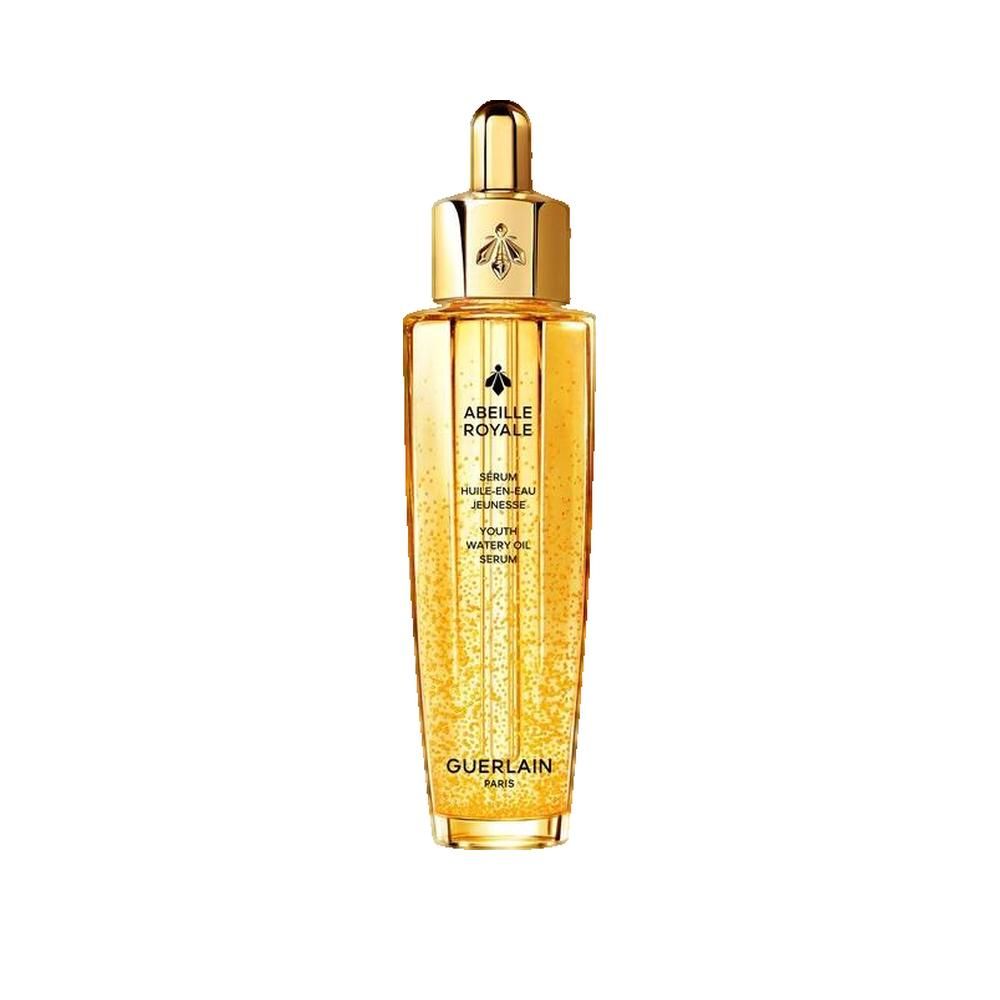 Flacon doré avec bouchon doré. Inscription: Abeille Royale, Sérum Huile en Eau Jeunesse, Guerlain Paris.