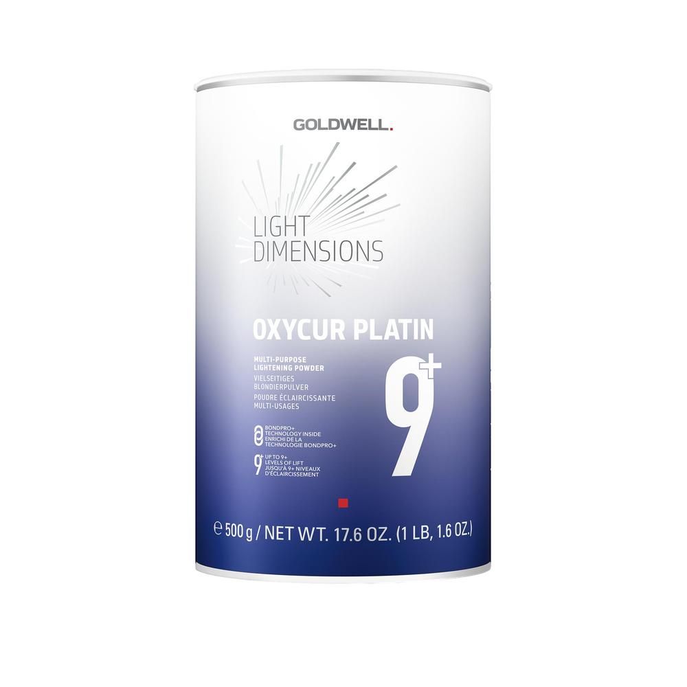 Boîte de poudre décolorante Goldwell Oxycur Platin 9+. Boîte blanche et bleue avec nom et "9+". Poids: 500g.