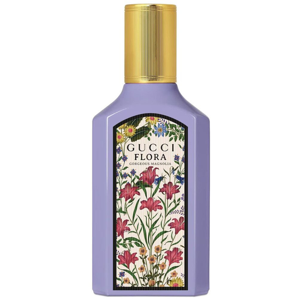 Flacon Gucci Flora Gorgeous Magnolia avec étiquette florale. Bouchon doré. Fond blanc.