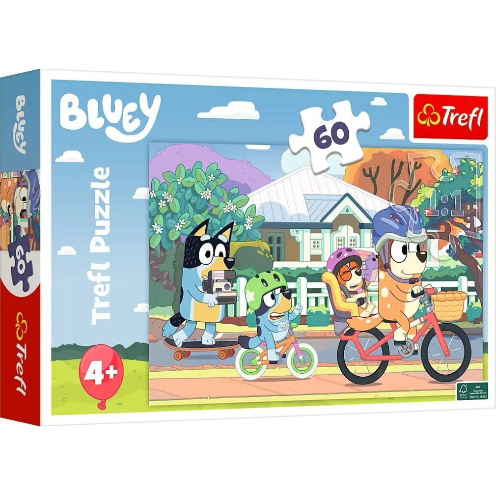 Boîte de puzzle avec illustration Bluey. Montre des personnages faisant du vélo et du skate. Contient 60 pièces, recommandé pour les 4 ans et plus.