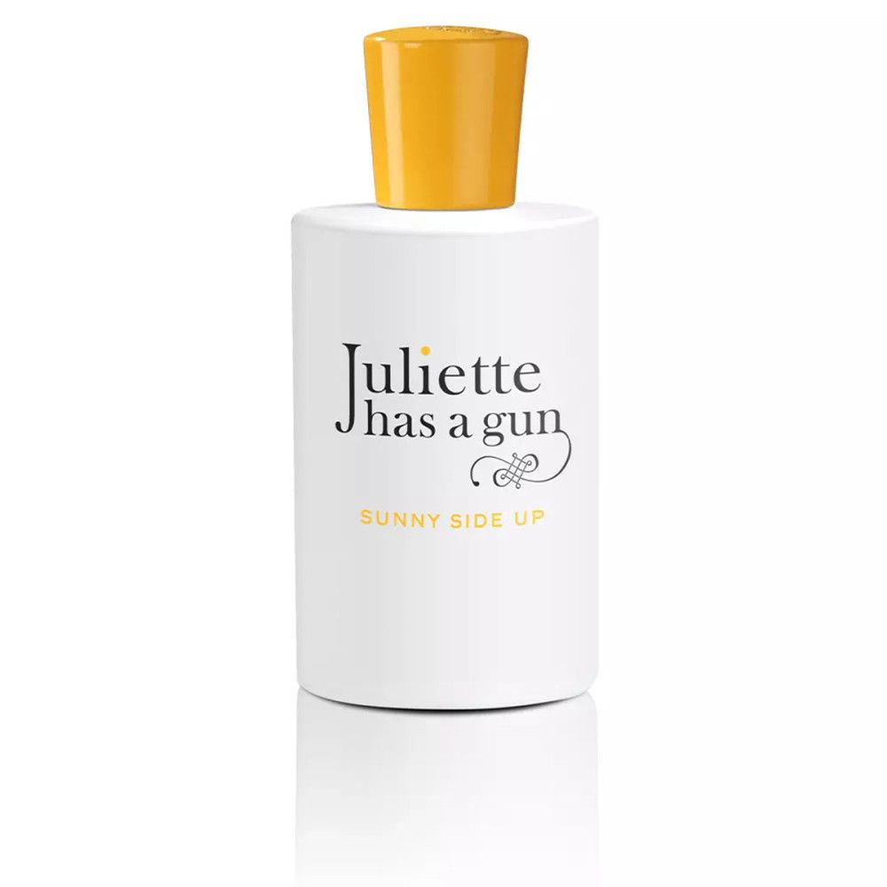 Flacon blanc à bouchon jaune. Texte noir: Juliette has a gun, Sunny Side Up.