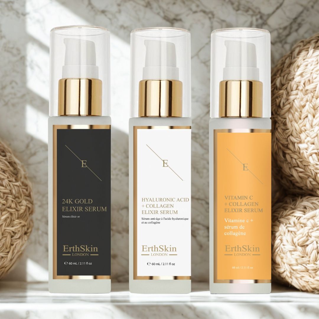 Trois flacons de sérum avec bouchons dorés et étiquettes. Inscriptions : 24K Gold, Acide Hyaluronique + Collagène, Vitamine C + Collagène. Marque : ErthSkin London.