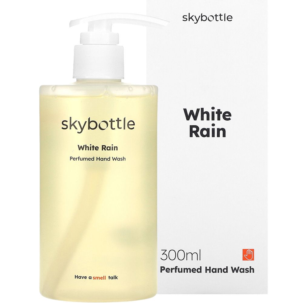 Vloeibare zeep met witte pomp en doos. Opschrift: skybottle, White Rain, Perfumed Hand Wash. Doos: White Rain, 300ml, Perfumed Hand Wash.