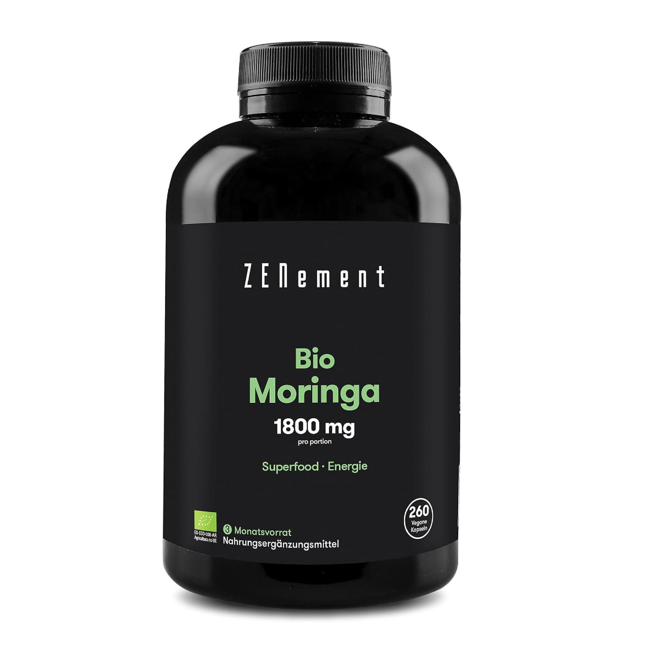 Zwarte fles Zenement Bio Moringa capsules. Opschriften: 1800 mg, superfood-energie, maandvoorraad, voedingssupplement.