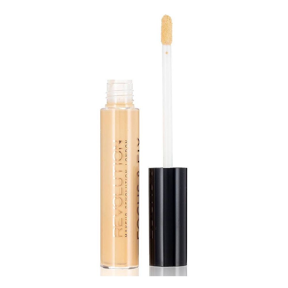 Correcteur liquide dans un flacon transparent avec bouchon noir et applicateur. Le contenu du flacon est beige clair.