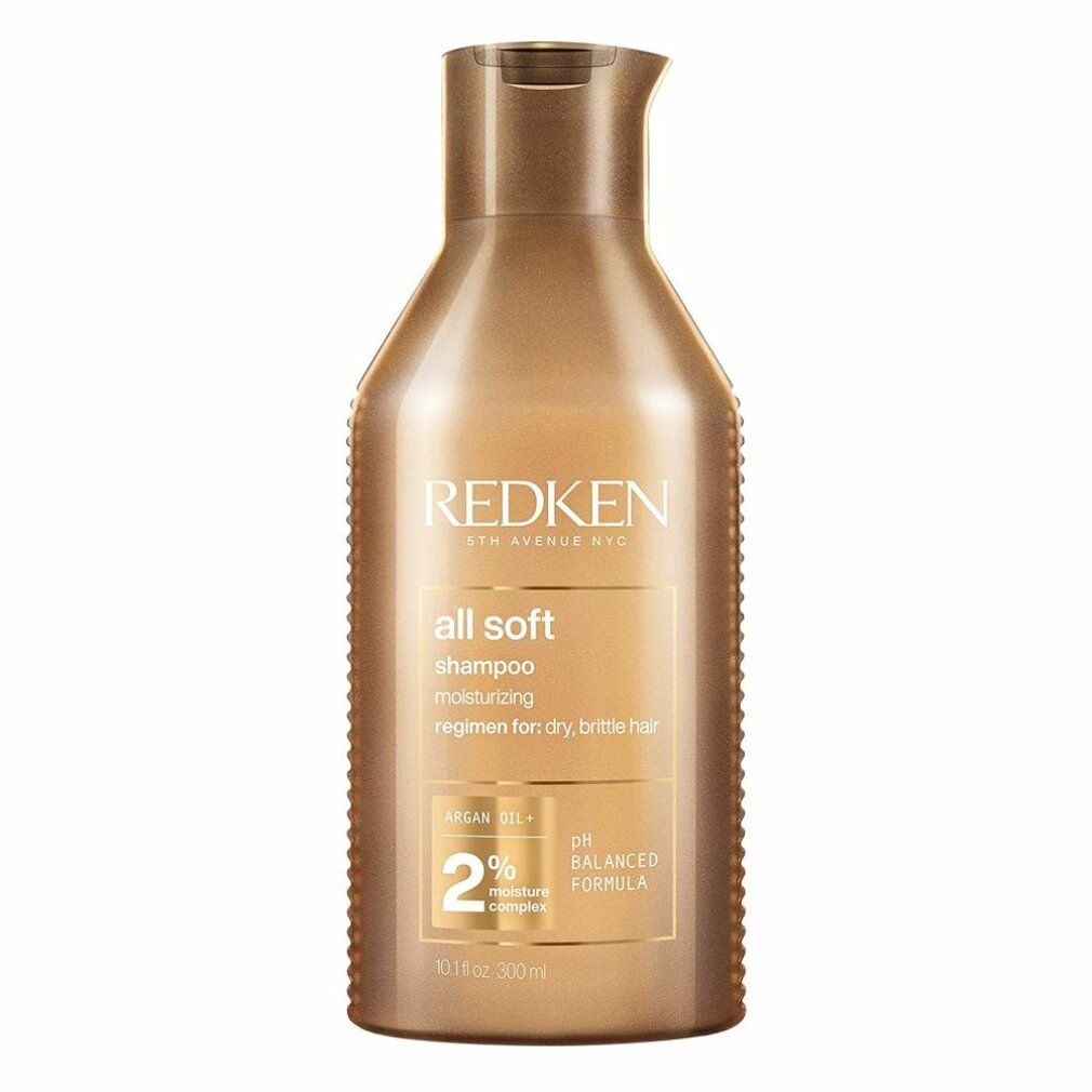 Gouden shampoo fles. Opschrift: Redken, all soft, shampoo. Bevat arganolie en 2% vochtcomplex. pH-gebalanceerd.