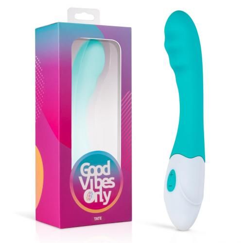 Vibrateur turquoise et blanc dans son emballage. Fenêtre transparente, marque "Good Vibes Only".
