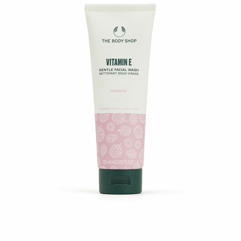 Tube The Body Shop Vitamin E Gentle Facial Wash, 125 ml. Tube blanche avec motif rose et bouchon vert.