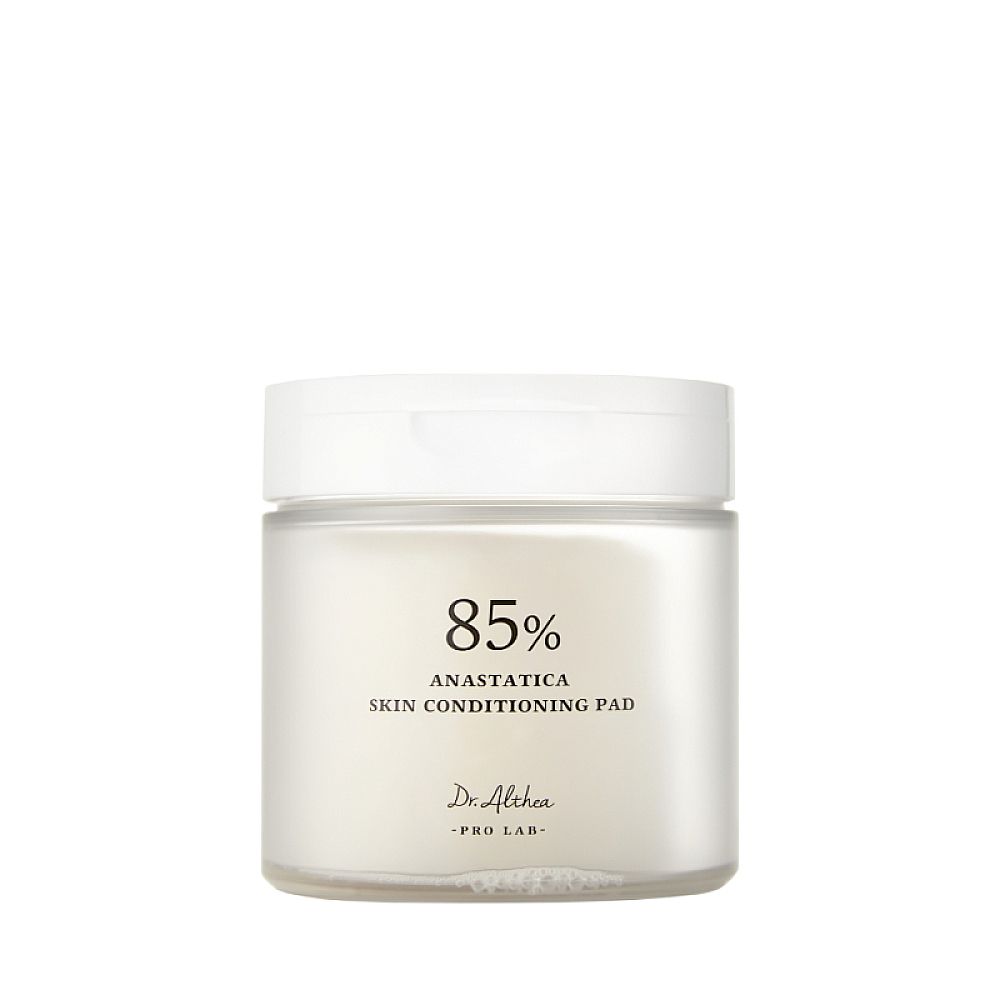 Pot rond blanc avec couvercle. Inscription : 85% Anastatica Skin Conditioning Pad. Marque : Dr. Althea.