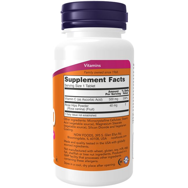 Witte fles met paarse dop. Etiket met ingrediënten en voedingswaarde. Tekst: Vitamine C, Rozenbottel, Now Foods.