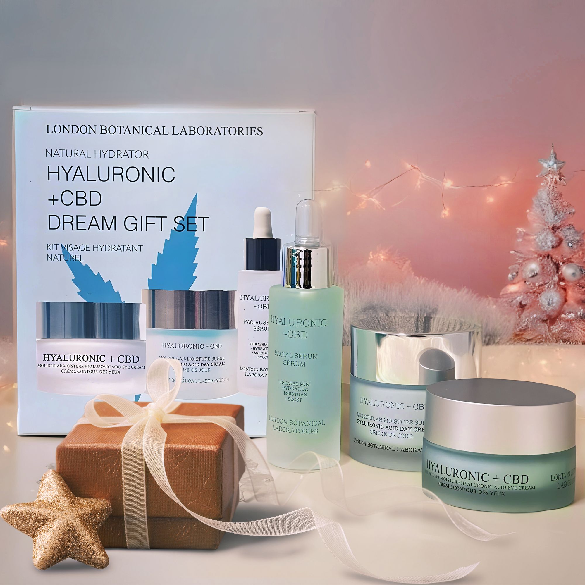 Coffret cadeau London Botanical Laboratories Hyaluronic + CBD avec crème visage, contour des yeux et sérum, décoré pour Noël.