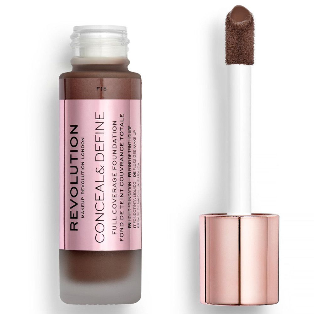 Fond de teint liquide en flacon de verre avec applicateur. Étiquette rose avec nom et marque. Couleur brun foncé.