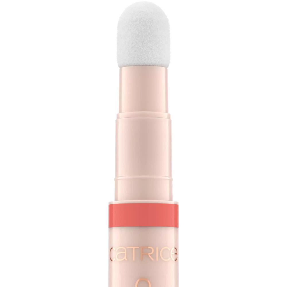 Catrice Colour Cushion Juicy Lippenöl. Roze tube met applicator. Tekst: Catrice, Colour Cushion, Juicy Lip Oil.