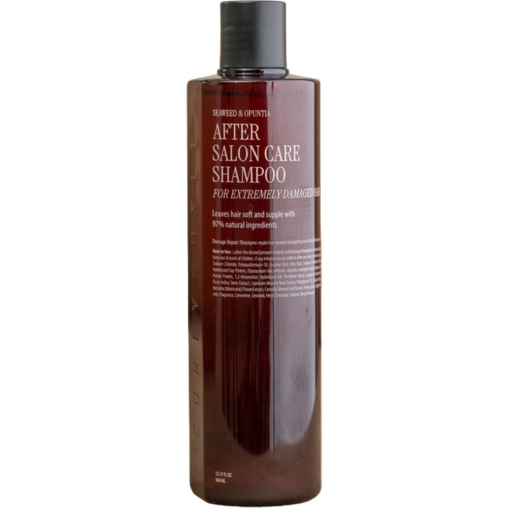 Bruine shampoo fles met zwarte dop. Opschrift: After Salon Care Shampoo voor extreem beschadigd haar. 97% natuurlijke ingrediënten.