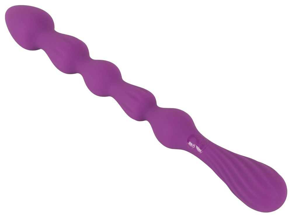 Baguette violette perlée avec des rainures ondulées et des bosses sphériques.