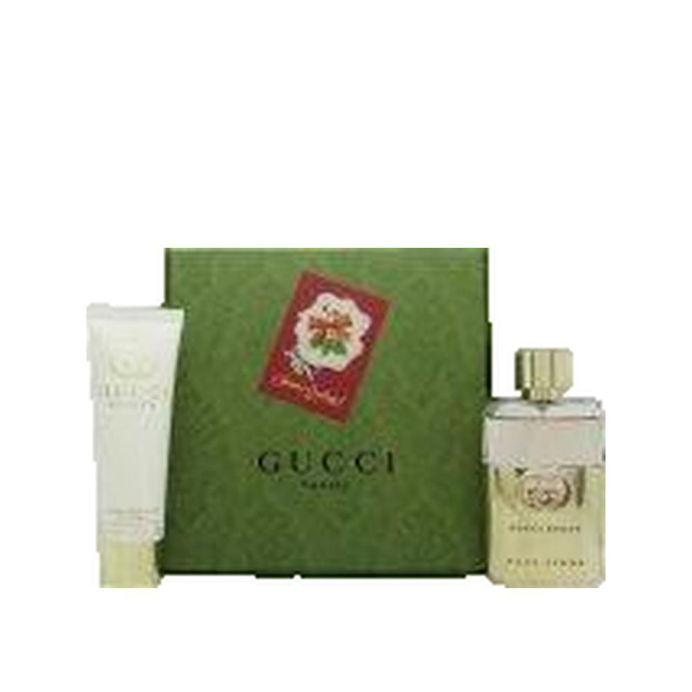 Geschenkset met parfum, lotion en groene doos. Gucci-logo en productnaam op de fles.