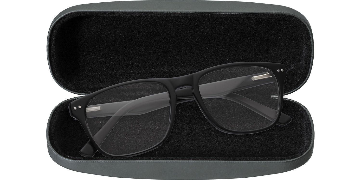Étui rigide ouvert, gris. Lunettes à monture noire. Intérieur noir. Montana Eyewear non visible.