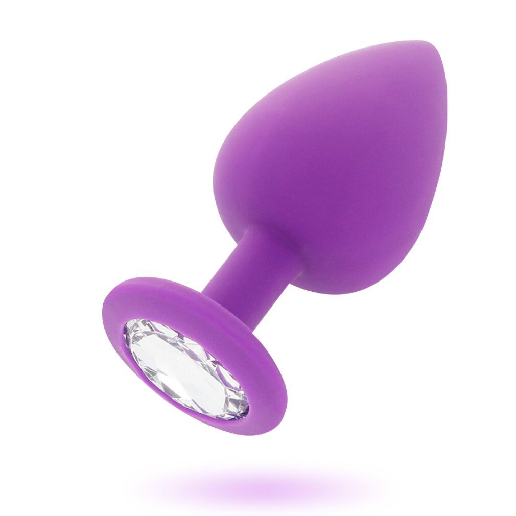 Plug anal violet en silicone avec un cristal facetté sur la bride.