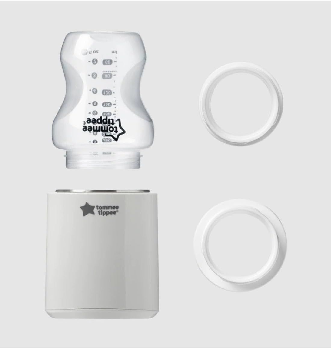 Witte babyfleswarmer met een transparante babyfles en twee witte ringen.