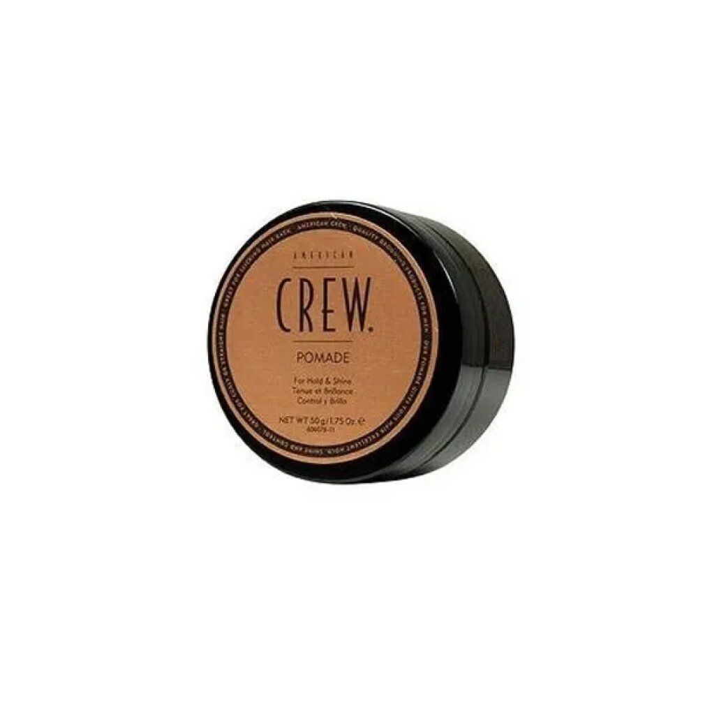 Ronde zwarte pot met bruin deksel. Opschrift: CREW. Pomade. Voor hold & glans. Netto 50g/1.75 Oz.