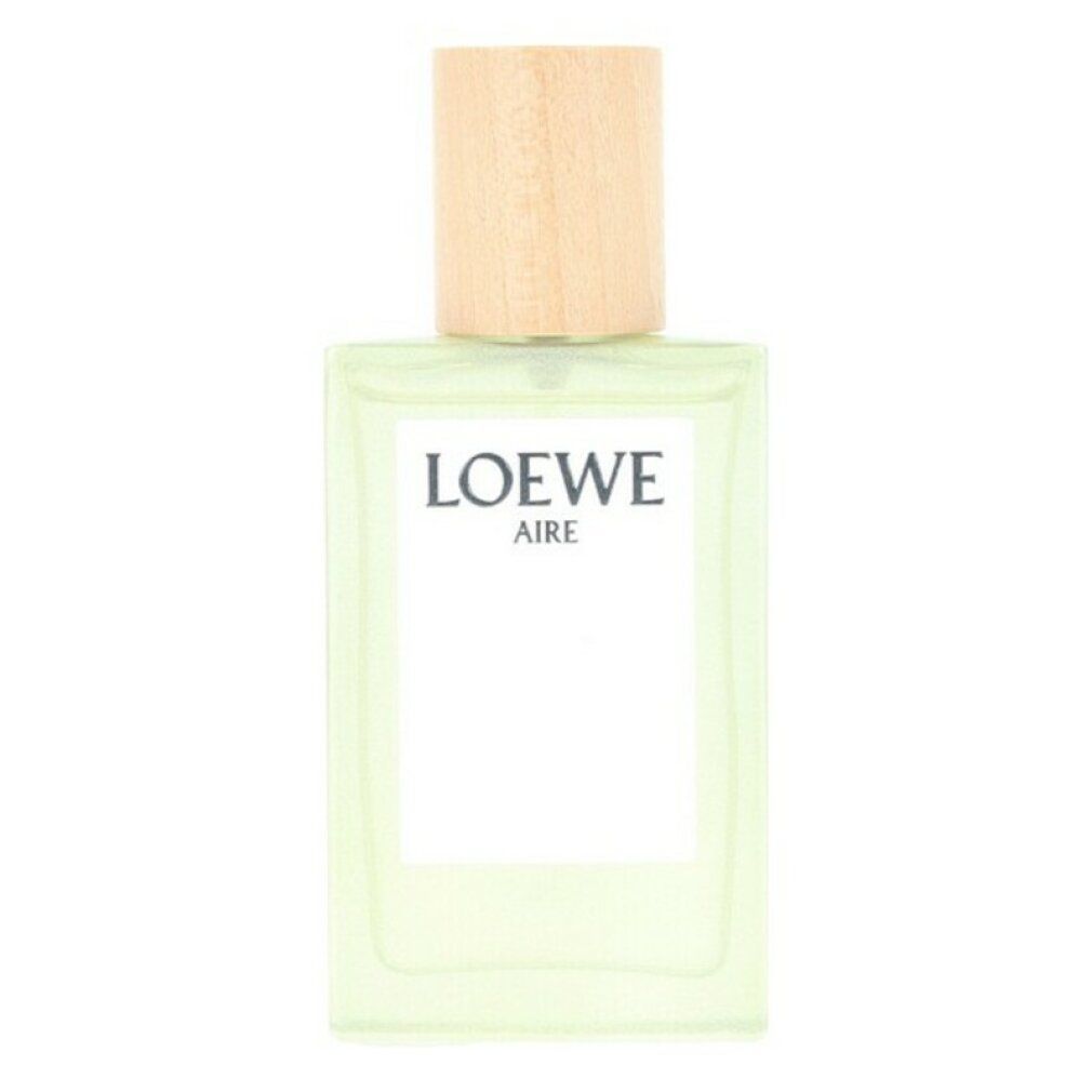 Flacon Loewe Aire Edt Spray. Flacon rectangulaire avec bouchon en bois. Liquide jaune clair visible.