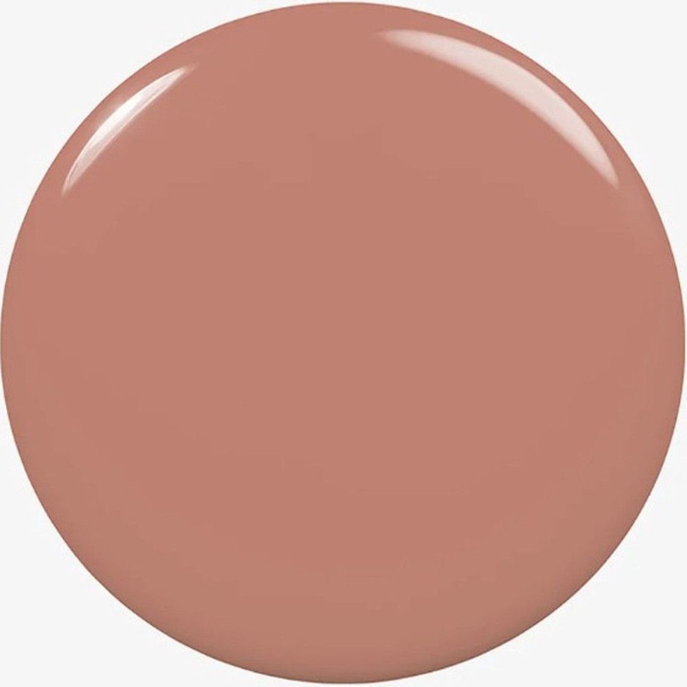 Tache circulaire de vernis à ongles de couleur rose-brun. Surface brillante.