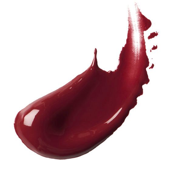 Vlek van donkerrode lipstick. Glanzende textuur.