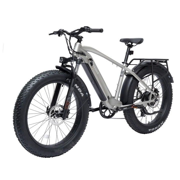 VTT électrique gris avec pneus noirs et porte-bagages. Pneus Kenda. Freins à disque. Bodywel D6.