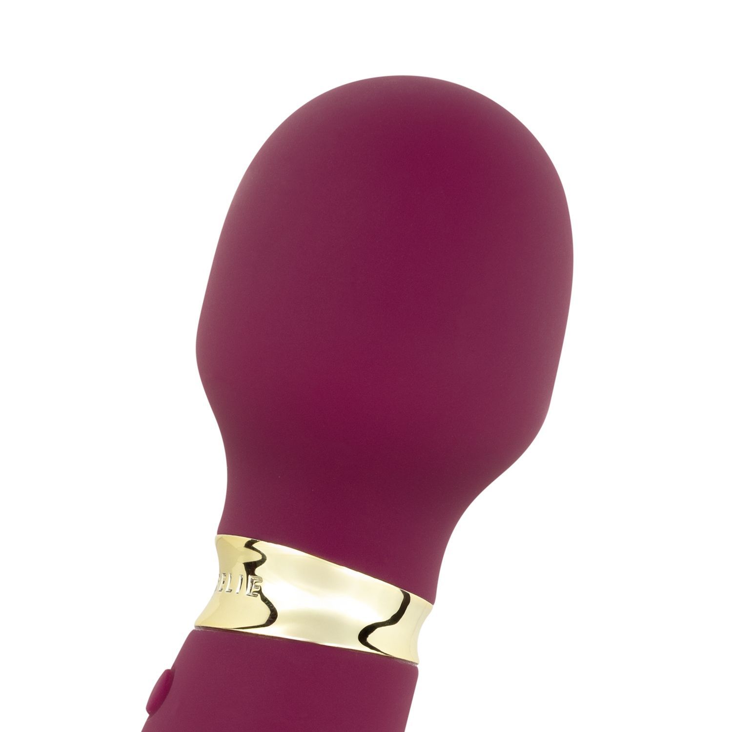 Close-up van de afgeronde kop van een paarse vibrator. Gouden ring.
