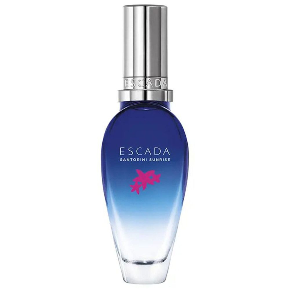 Blauw-transparante fles met zilveren dop. Opschrift: ESCADA SANTORINI SUNRISE. Roze bloemen decoratie.