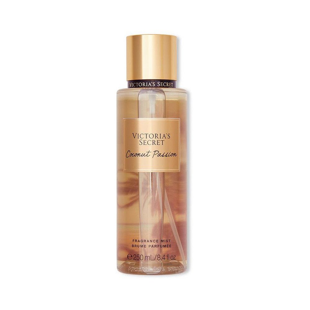 Flacon de brume corporelle avec bouchon doré. Inscription: Victoria's Secret, Coconut Passion, Fragrance Mist.