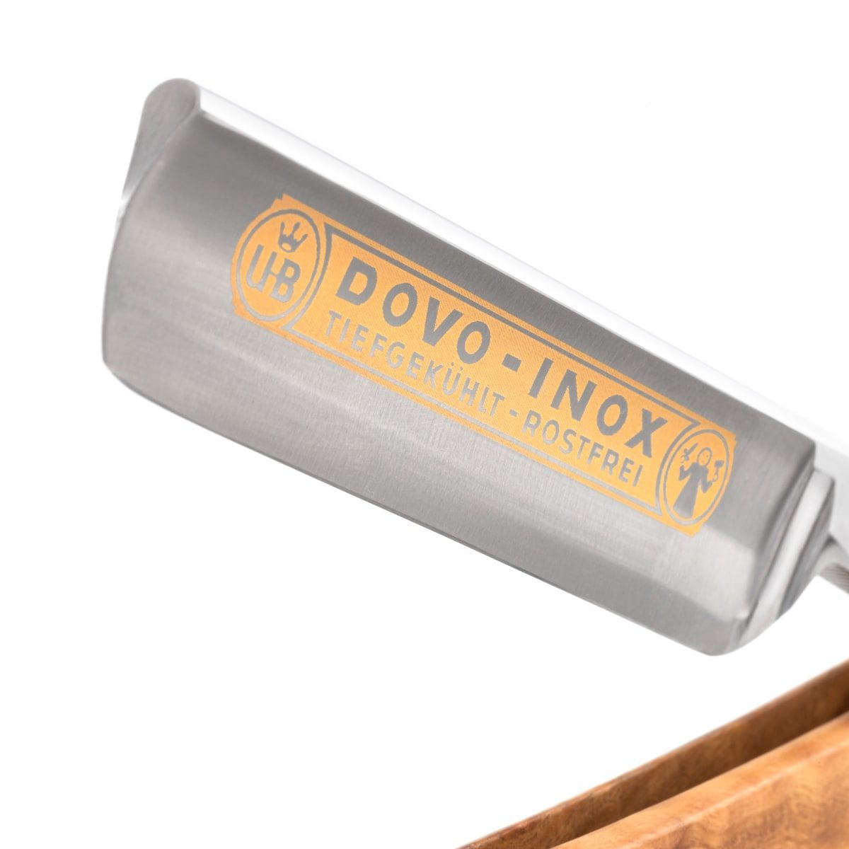Scheermes met gouden DOVO-INOX logo. Metalen mes, houten handvat. Detailopname.