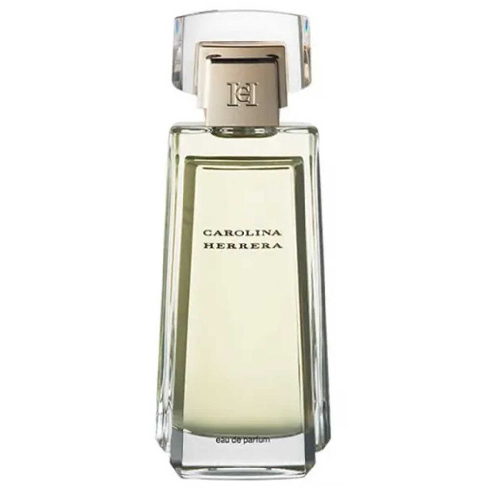 Rechthoekige parfumfles van transparant glas, gouden dop. Opschrift: CAROLINA HERRERA. Eau de parfum.