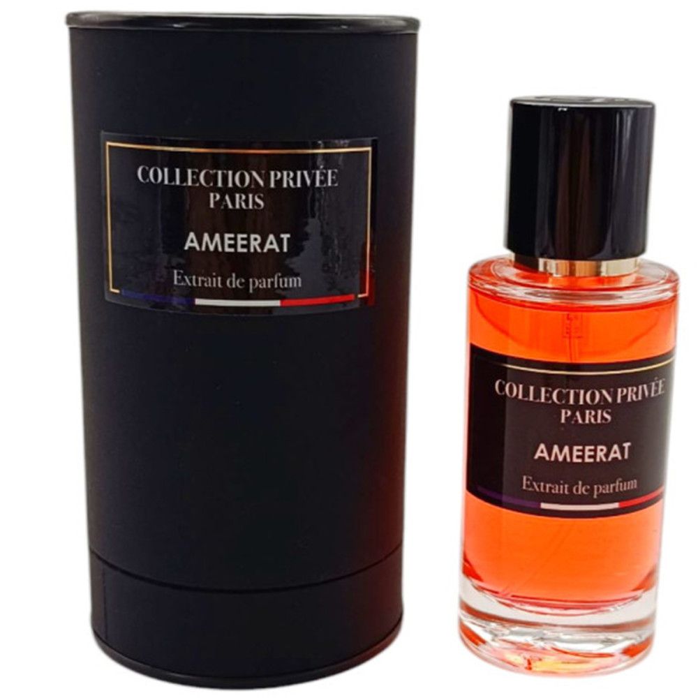 Parfumextractfles en cilindrische verpakking. Zwarte fles met zwarte dop. Label met productnaam en merk.