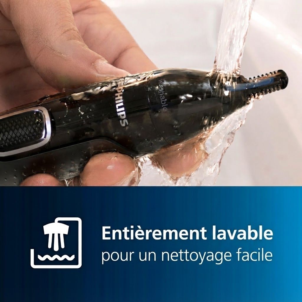 Tondeuse à nez Philips noire nettoyée sous l'eau courante.