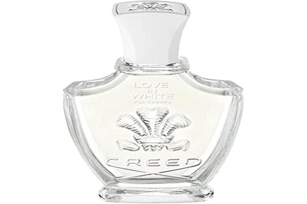 Glazen fles met witte dop. Opschrift: LOVE IN WHITE FOR WOMEN, CREED.