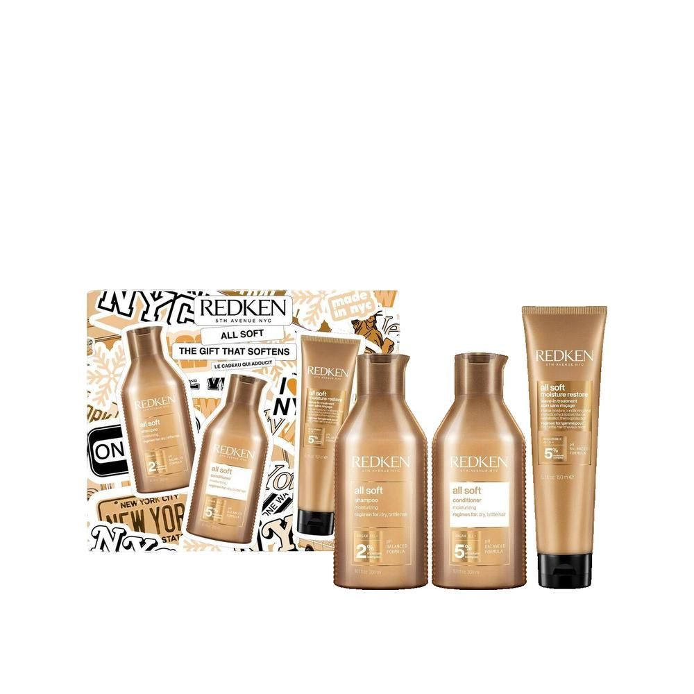 Coffret cadeau avec plusieurs produits capillaires Redken. Flacons et tubes dorés.