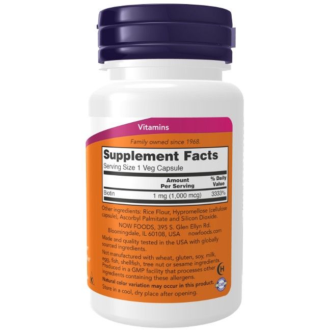 Flacon blanc avec bouchon violet. Étiquette "Supplement Facts" et "Biotin 1 mg".