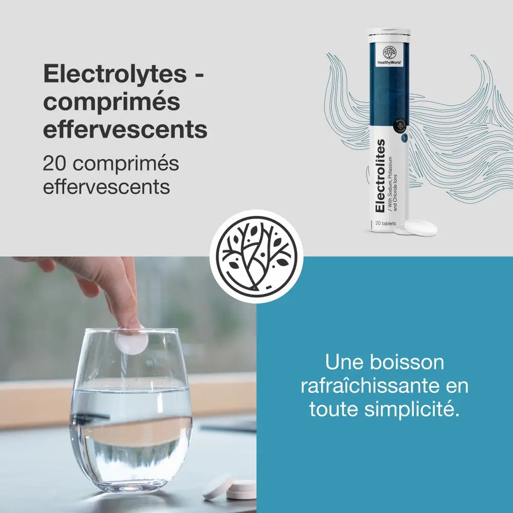 Un comprimé effervescent se dissout dans un verre d'eau, à côté un tube de comprimés d'électrolytes.