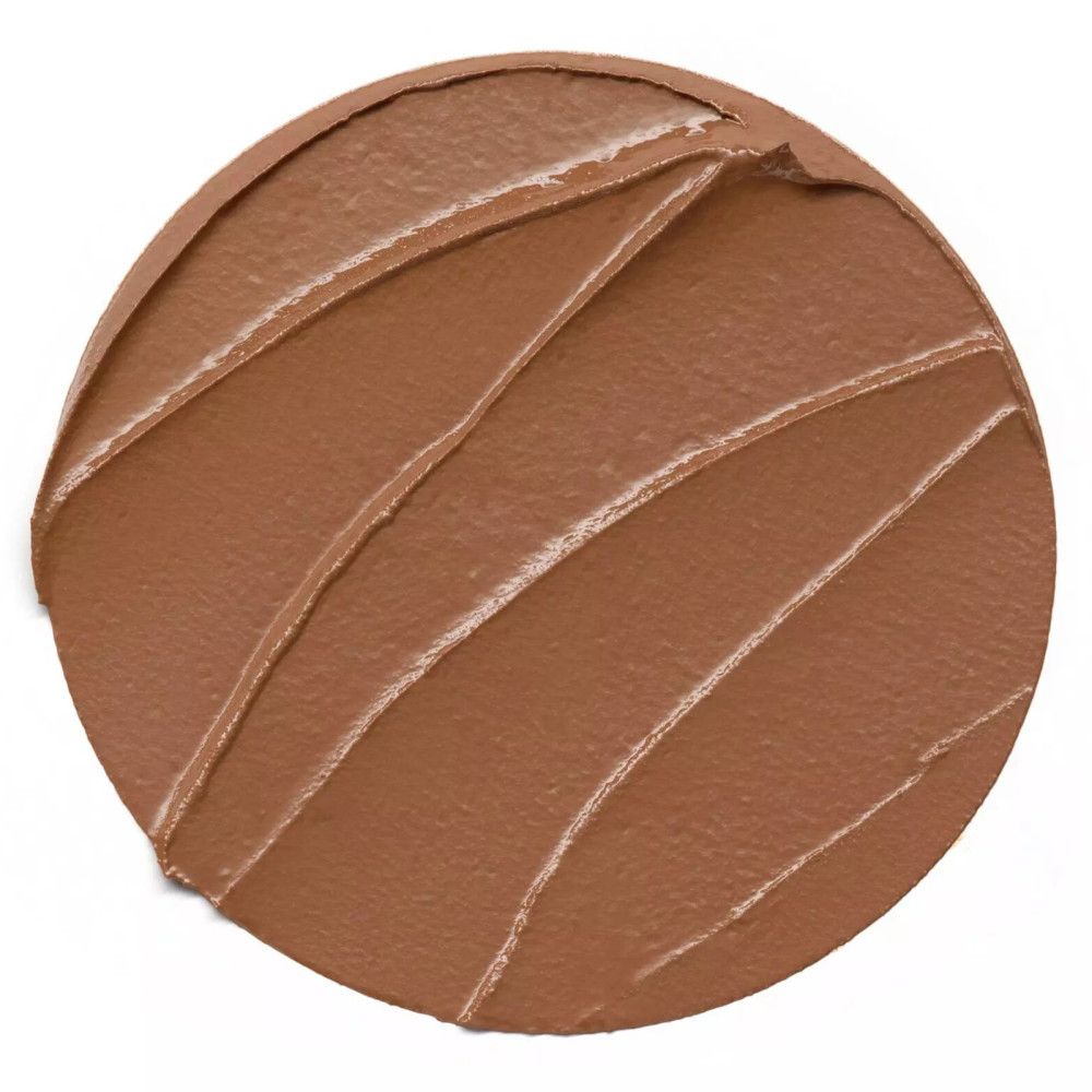 Texture bronzante marron sur fond blanc. Forme ronde avec stries diagonales.
