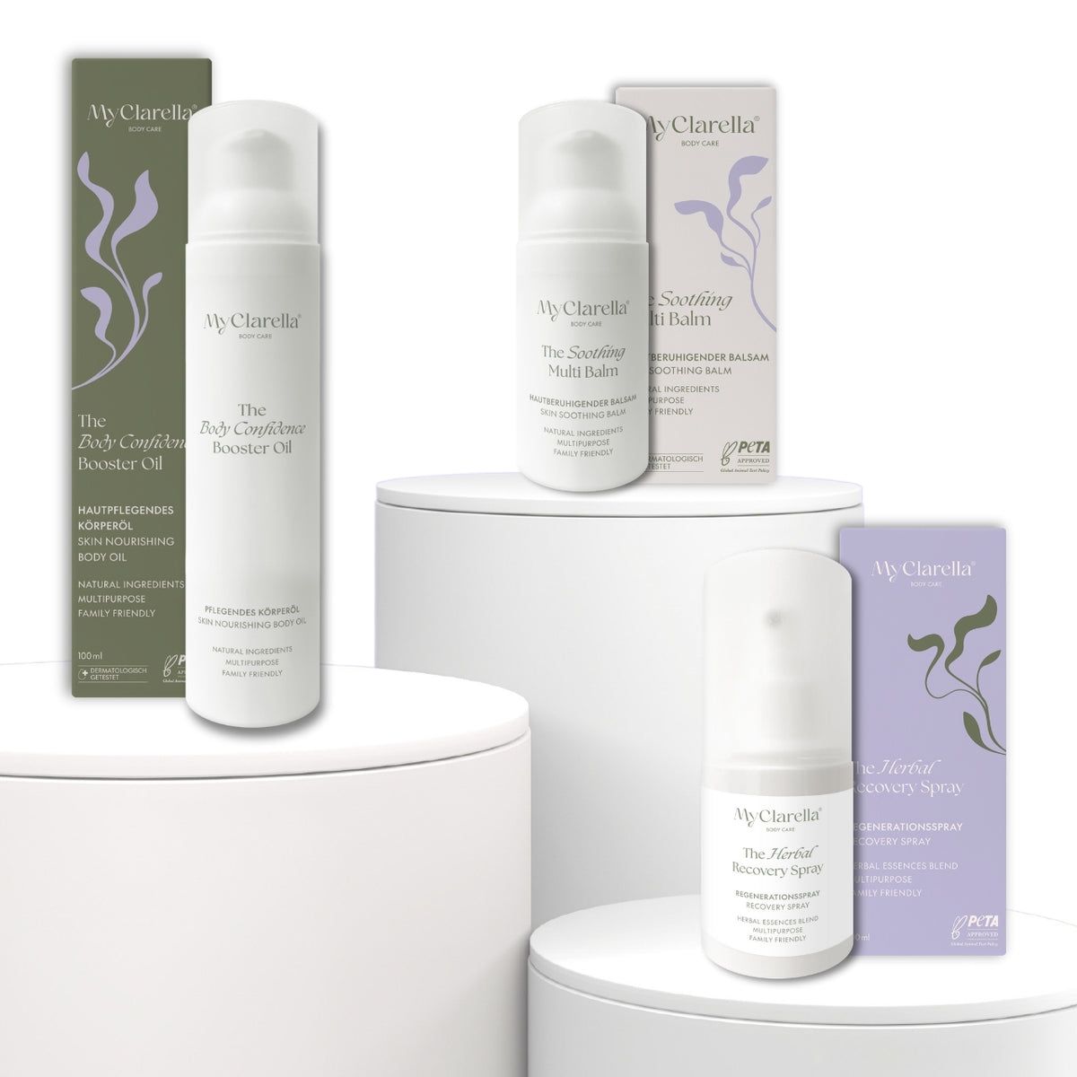 Trois produits et emballages. Texte: MyClarella. Body Confidence Booster Oil, The Soothing Multi Balm, The Herbal Recovery Spray.