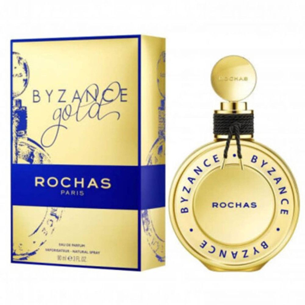 Gouden doos en fles. Opschrift: BYZANCE Gold, ROCHAS PARIS. Fles met zwarte band.