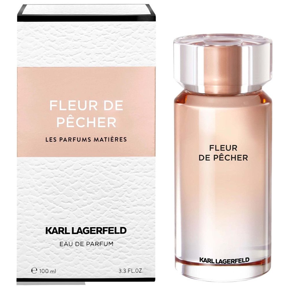 Fles en doos. Opschrift FLEUR DE PÊCHER, KARL LAGERFELD. Eau de Parfum. Witte verpakking met roze accent.
