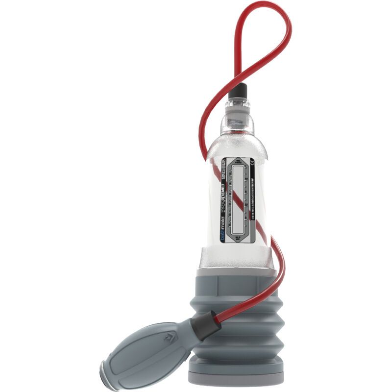 Pompe à pénis en plastique transparent avec soufflet gris et tube rouge. Avec échelle de mesure sur le cylindre.
