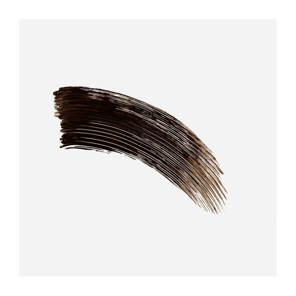 Tache de mascara brun noir sur fond gris.