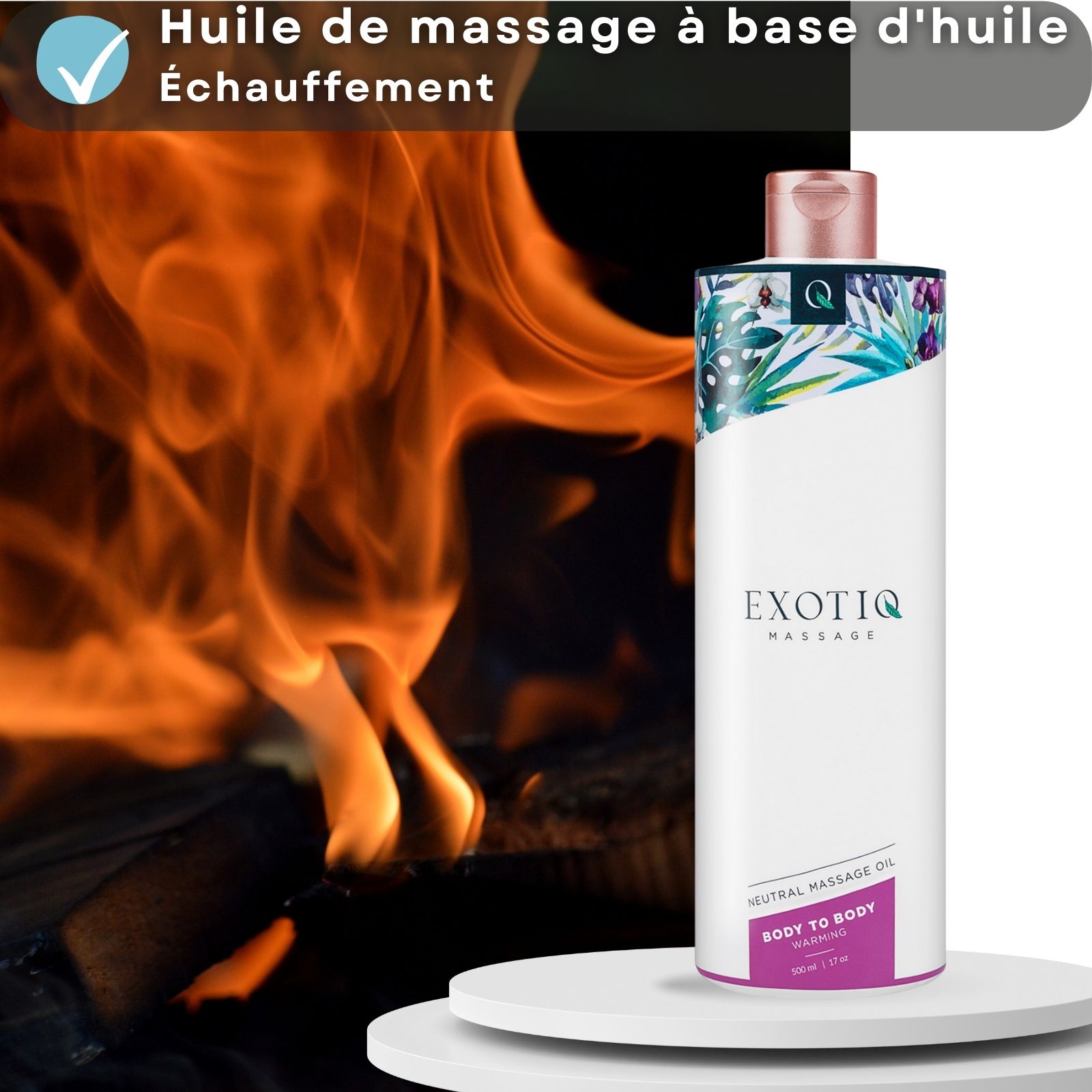 Flacon d'huile de massage devant un feu de cheminée. Texte : Body to Body Warming.