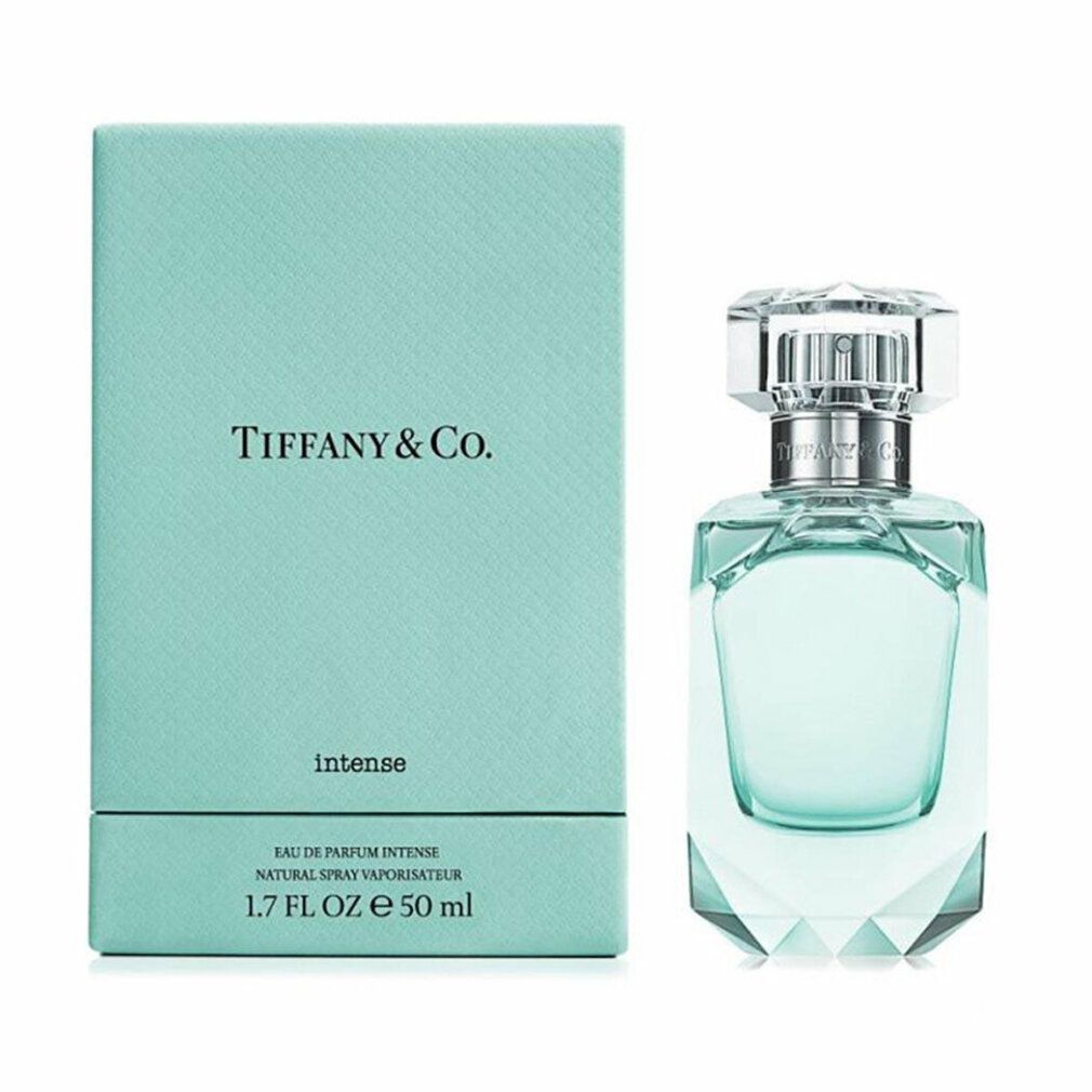 Turquoise doos en fles. Fles met zilveren sluiting en transparante dop. Opschrift: Tiffany & Co. Intense.